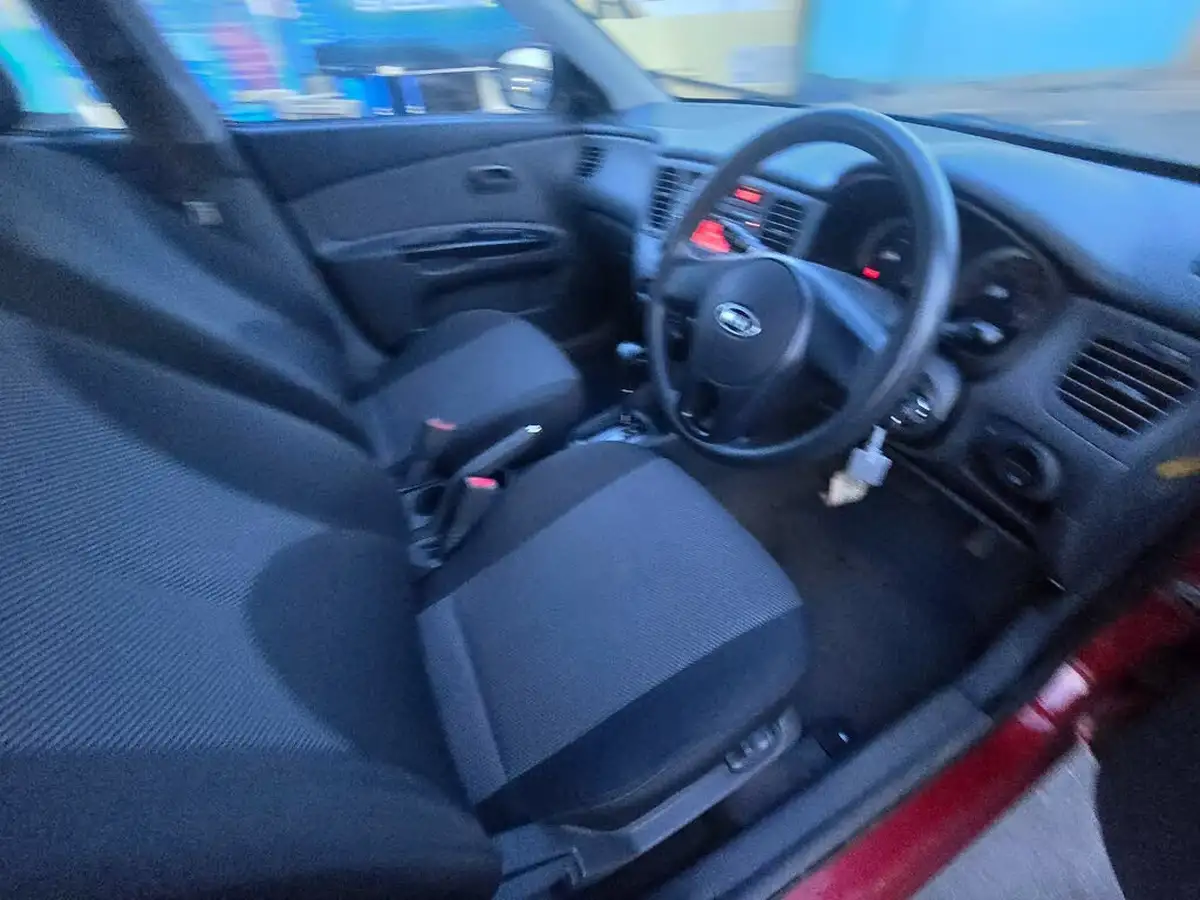 2010-kia-rio-14-strike-auto-big-1
